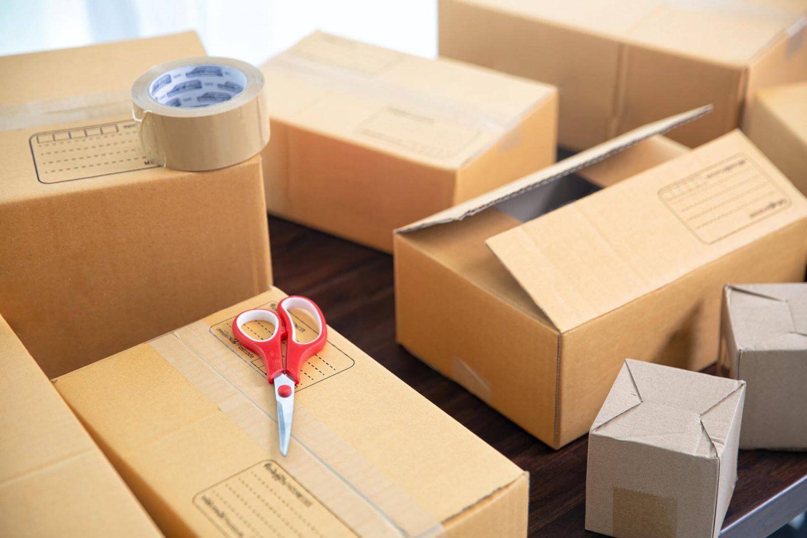 Cardboard parcel boxes on wooden table.